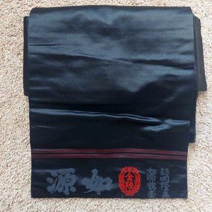 Striking black silk Nagoya obi with red and marroon details